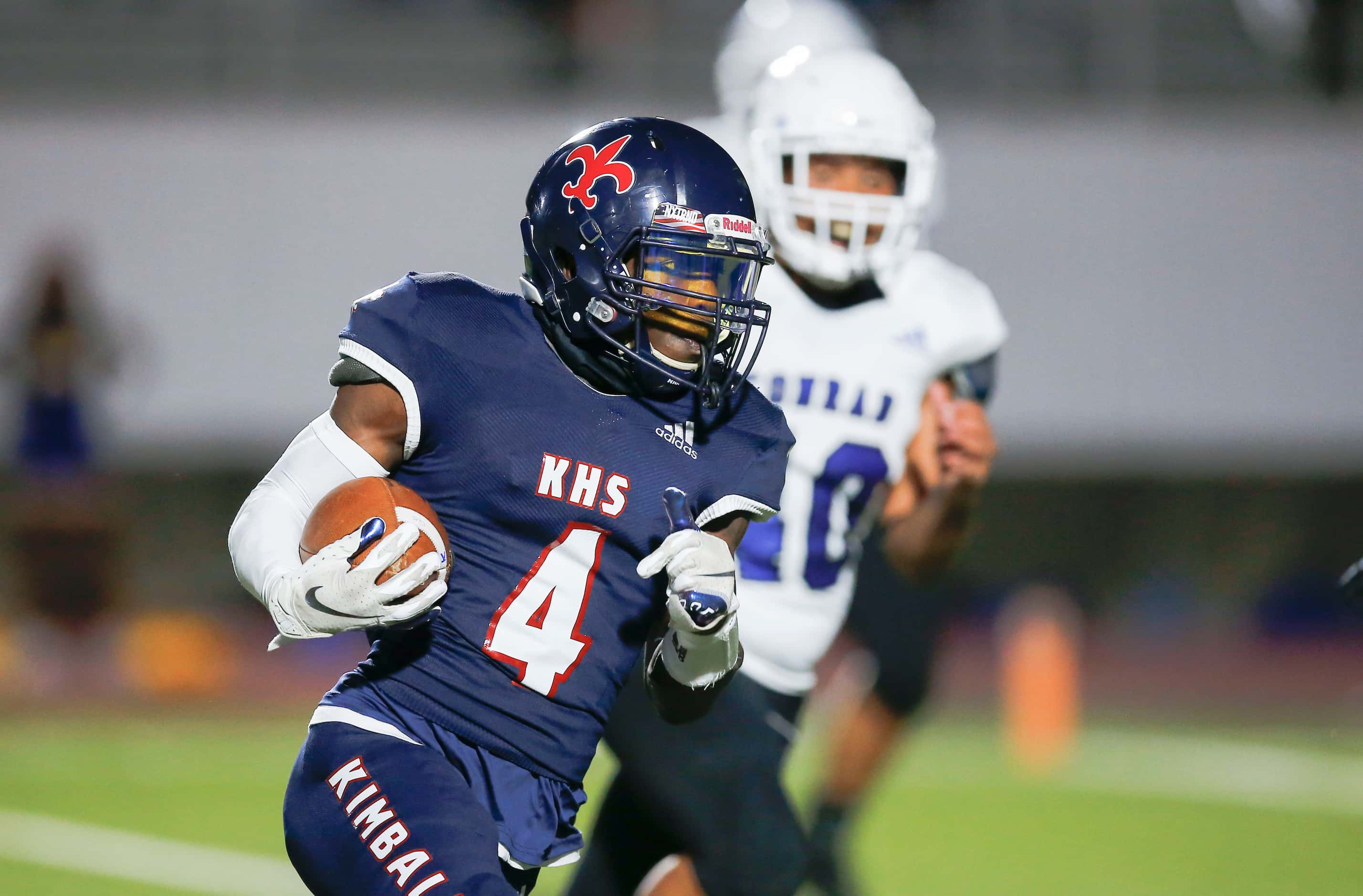 Kimball senior running back Niteroi Davis (4) carries the ball during the first half of a...