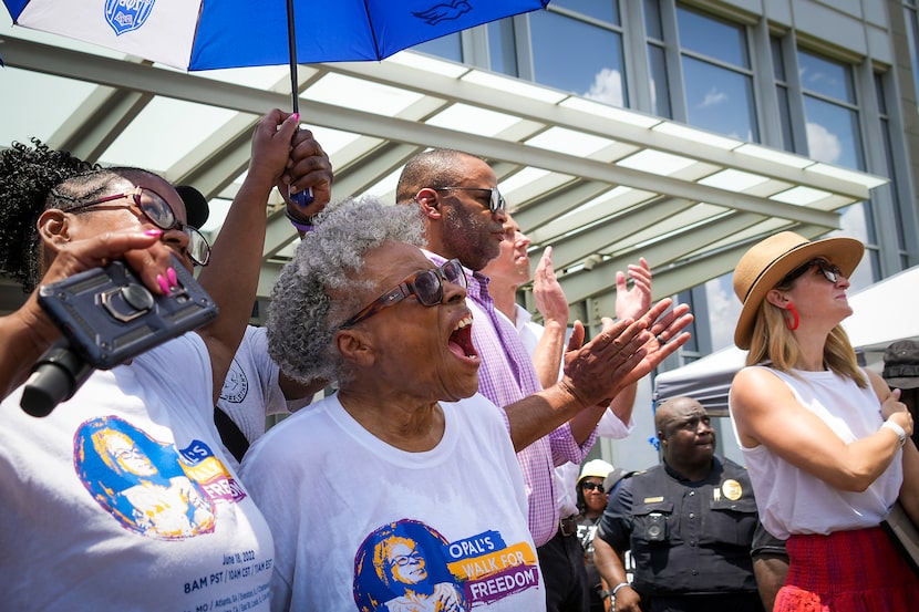 Opal Lee (center) cheers as the Juneteenth flag is raised at Fort Worth City Hall at the...