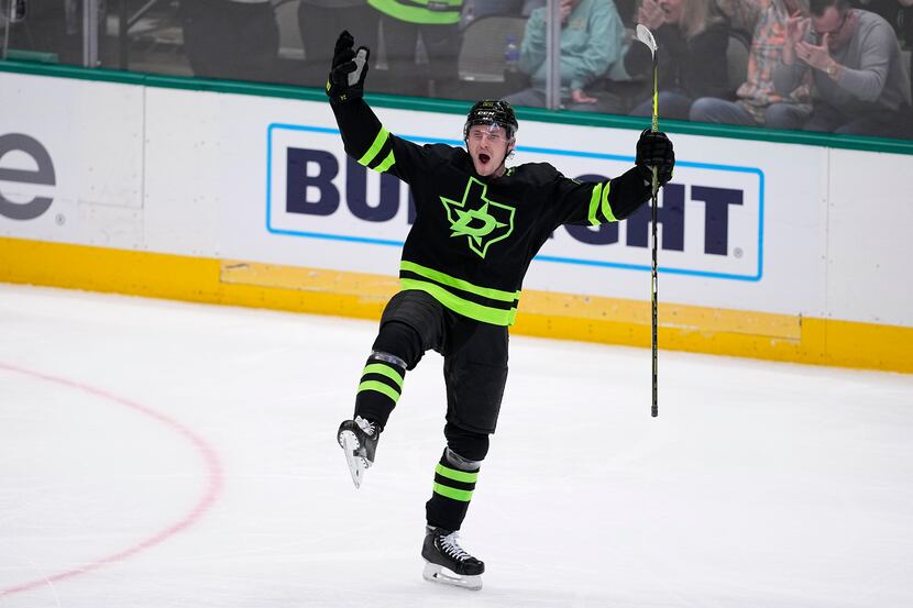 Dallas Stars center Roope Hintz celebrates scoring in the first period of an NHL hockey game...