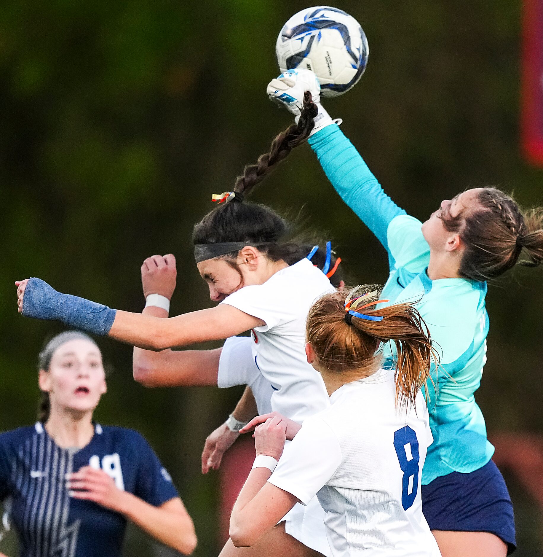 Prosper Walnut Grove goalkeeper Finley Pike punches a cross away from Frisco Wakeland Audrey...