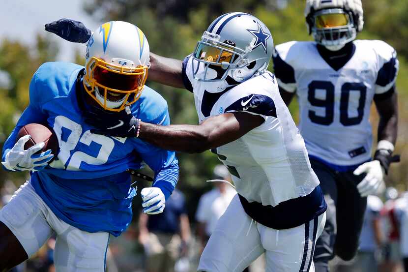 Dallas Cowboys cornerback Jourdan Lewis (2) tackles Los Angeles Chargers wide receiver...