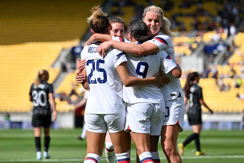 Players from the U.S. celebrate a goal against New Zealand during their women's...