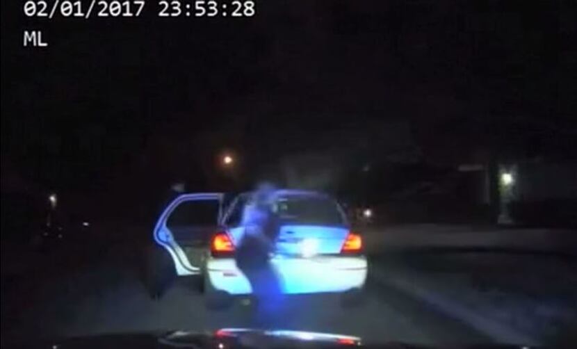 Dash-cam footage showed Arlington police Cpl. Elise Bowden run behind Tavis Crane's car...