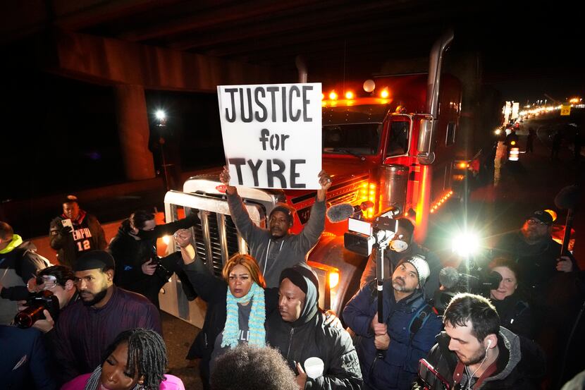 Protesters march down the street Friday, Jan. 27, 2023, in Memphis, Tenn., as authorities...
