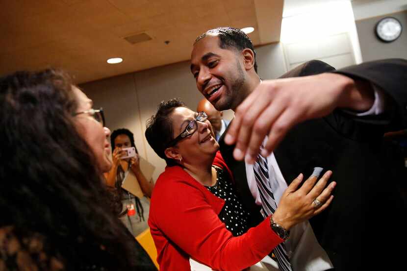 Quintin Lee Alonzo hugged his aunt, Joanne Alonzo-Gloria (center), and reached to hug his...