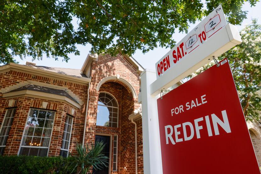 A “for sale” sign is displayed outside a Plano home in June.