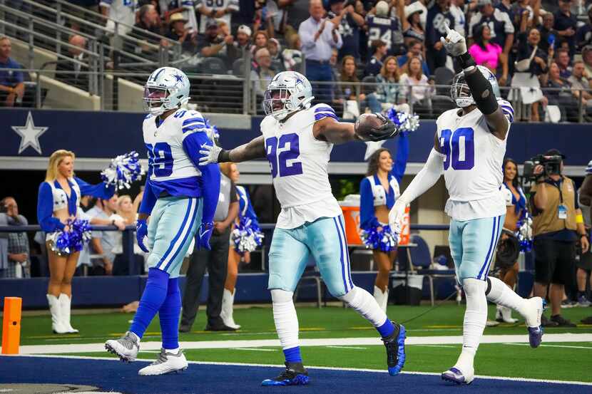 Dallas Cowboys defensive end Dorance Armstrong (92) celebrates with defensive end Chauncey...