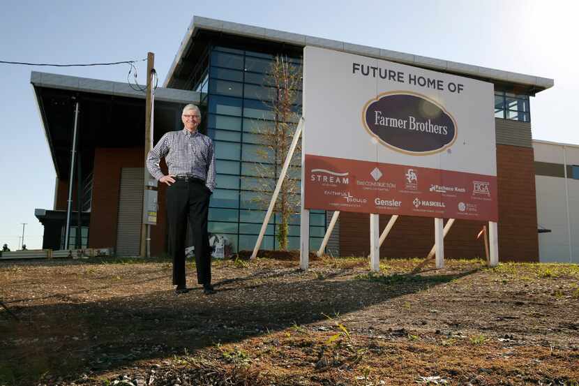 Michael Keown, CEO of Farmer Bros., stands in front of the company's new headquarters being...