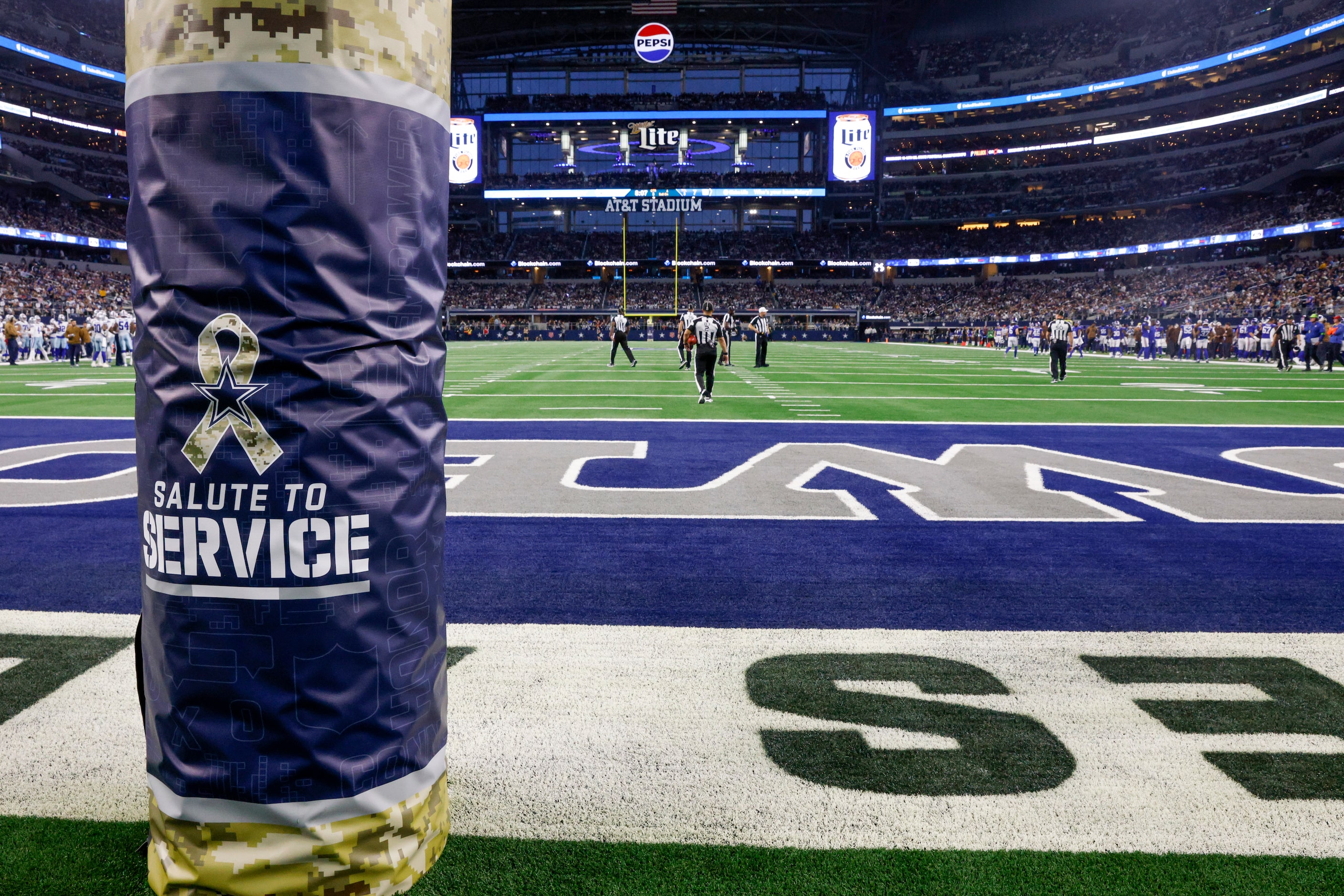 Salute to Service signage wraps a goal post during the second half of an NFL game between...