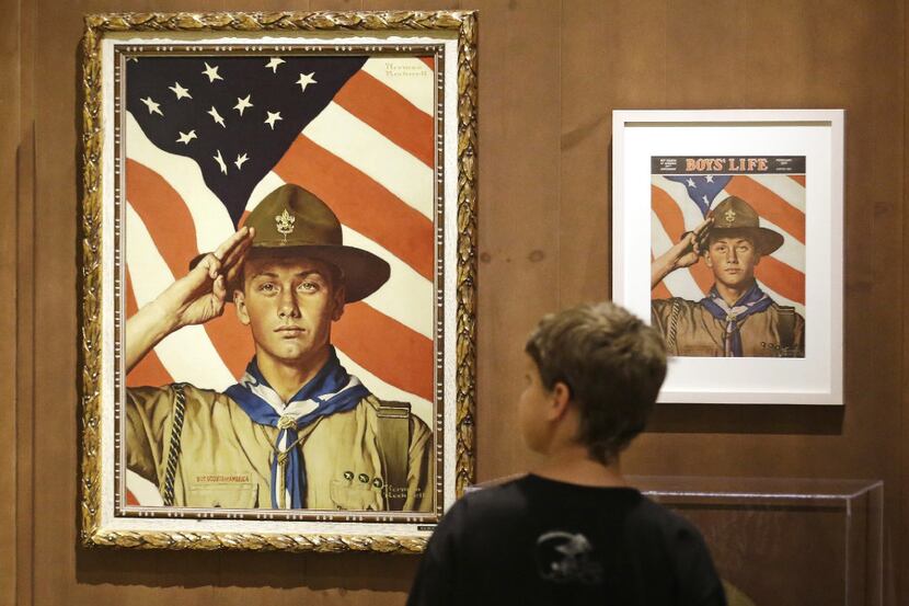 FILE - In this July 22, 2013, file photo, an 11-year-old boy looks over a Boy Scout-themed...