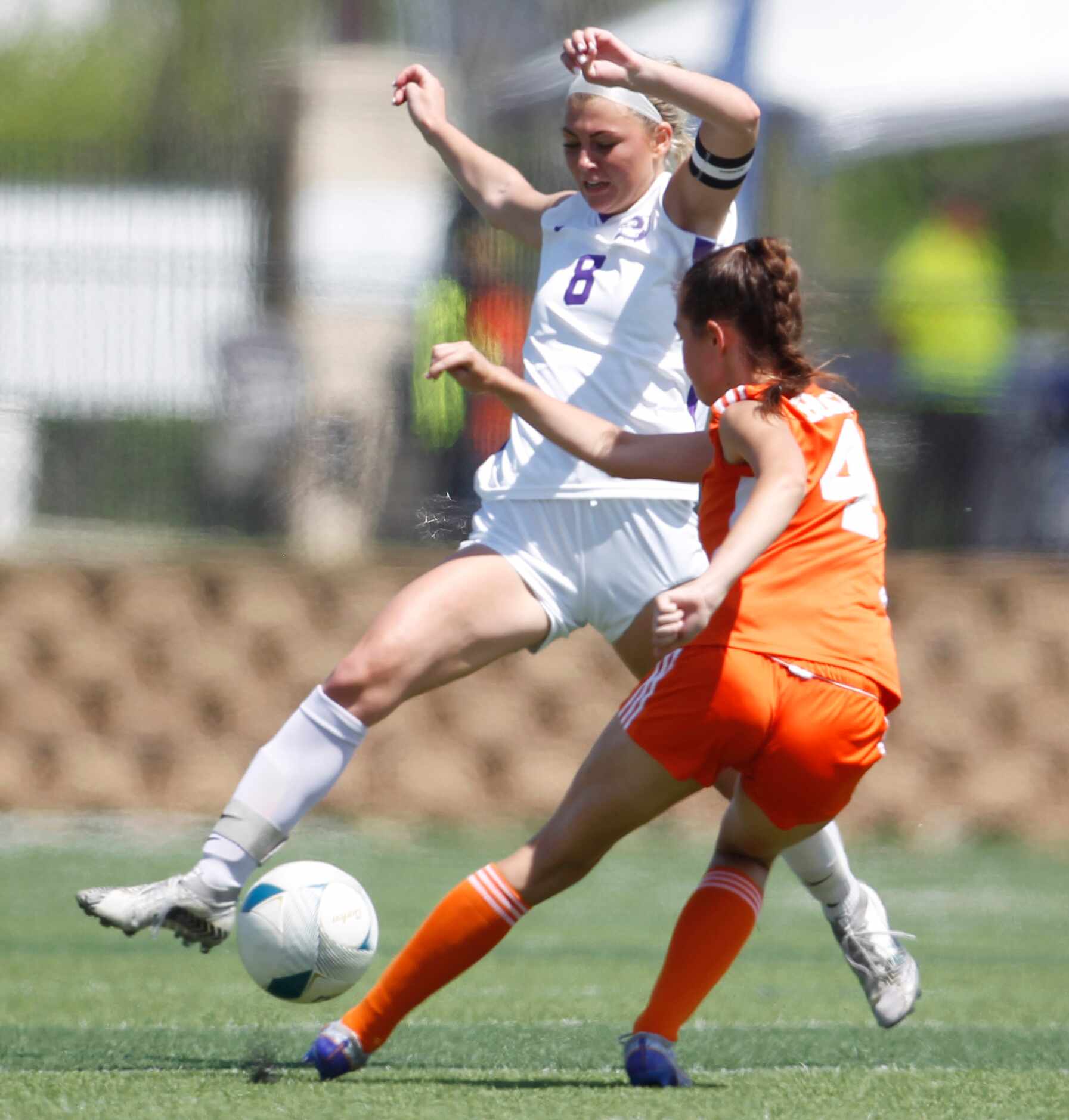 Celina's Makenna Brantley (4) sneaks a pass between the flying defense of Boerne's Kylie...