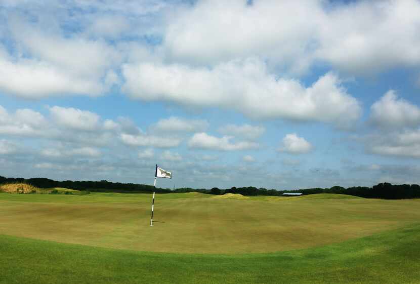 The dual green for holes 1 and 11, seen on a tour of the Trinity Forest Golf Club in Dallas,...