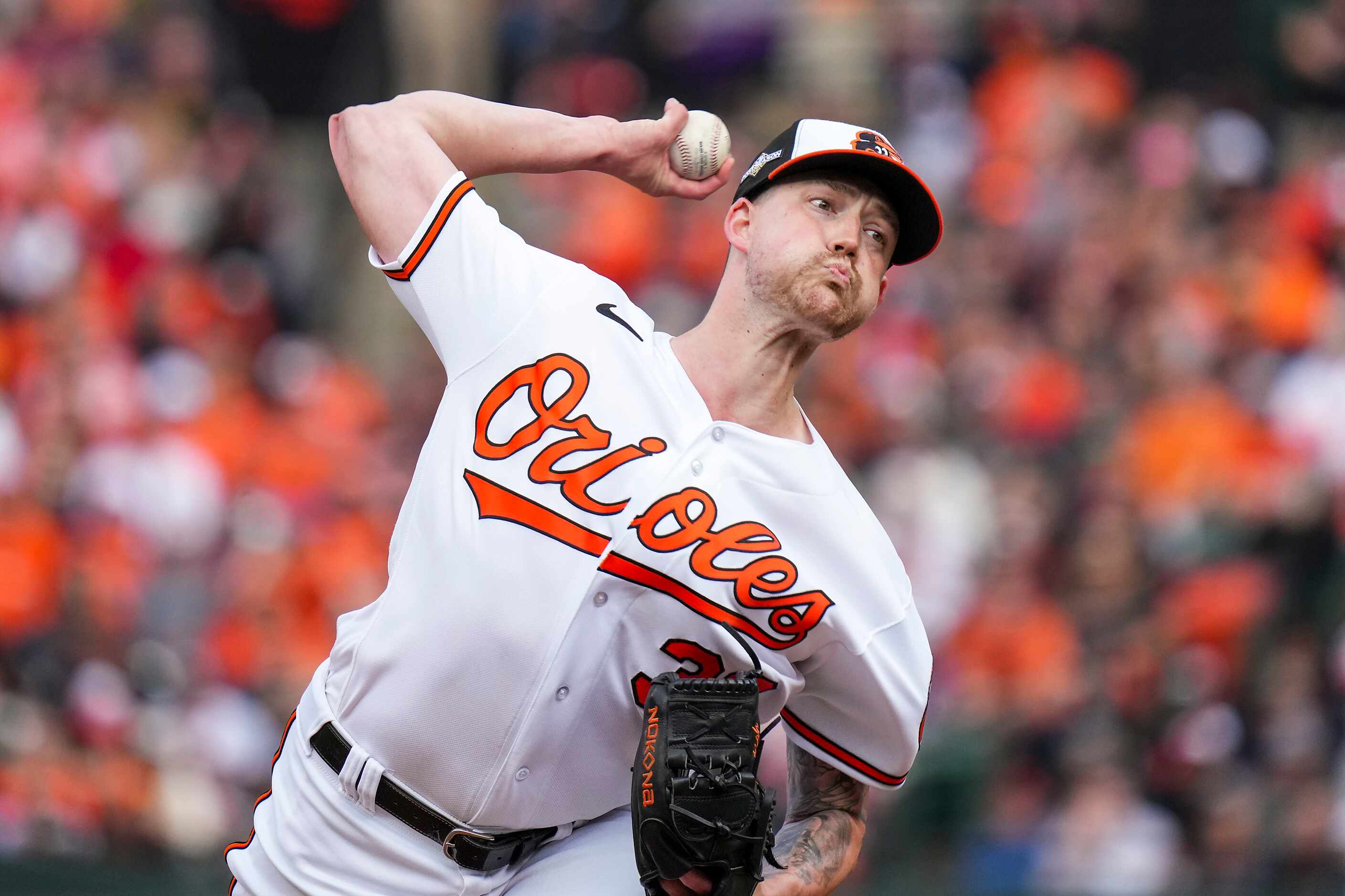 Baltimore Orioles starting pitcher Kyle Bradish delivers during the first inning in Game 1...