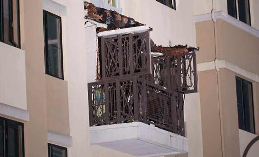 This image shows a close-up view of a fourth floor balcony that collapsed onto the balcony...
