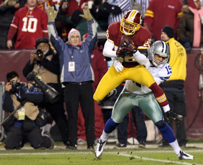 Washington Redskins cornerback Josh Wilson (26) intercepts a pass intended for Dallas...