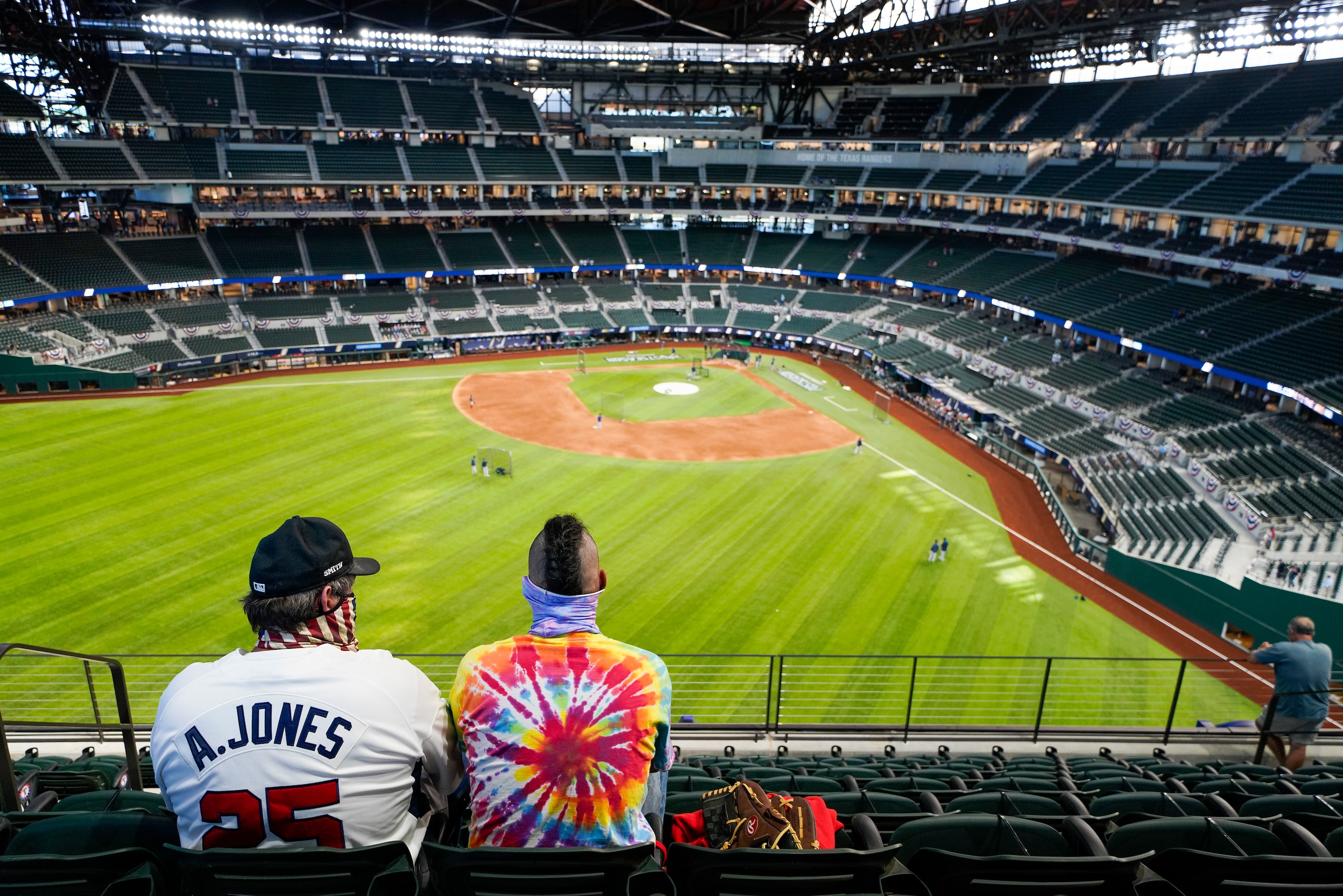 Fans watch batting practice before Game 1 of a National League Championship Series between...