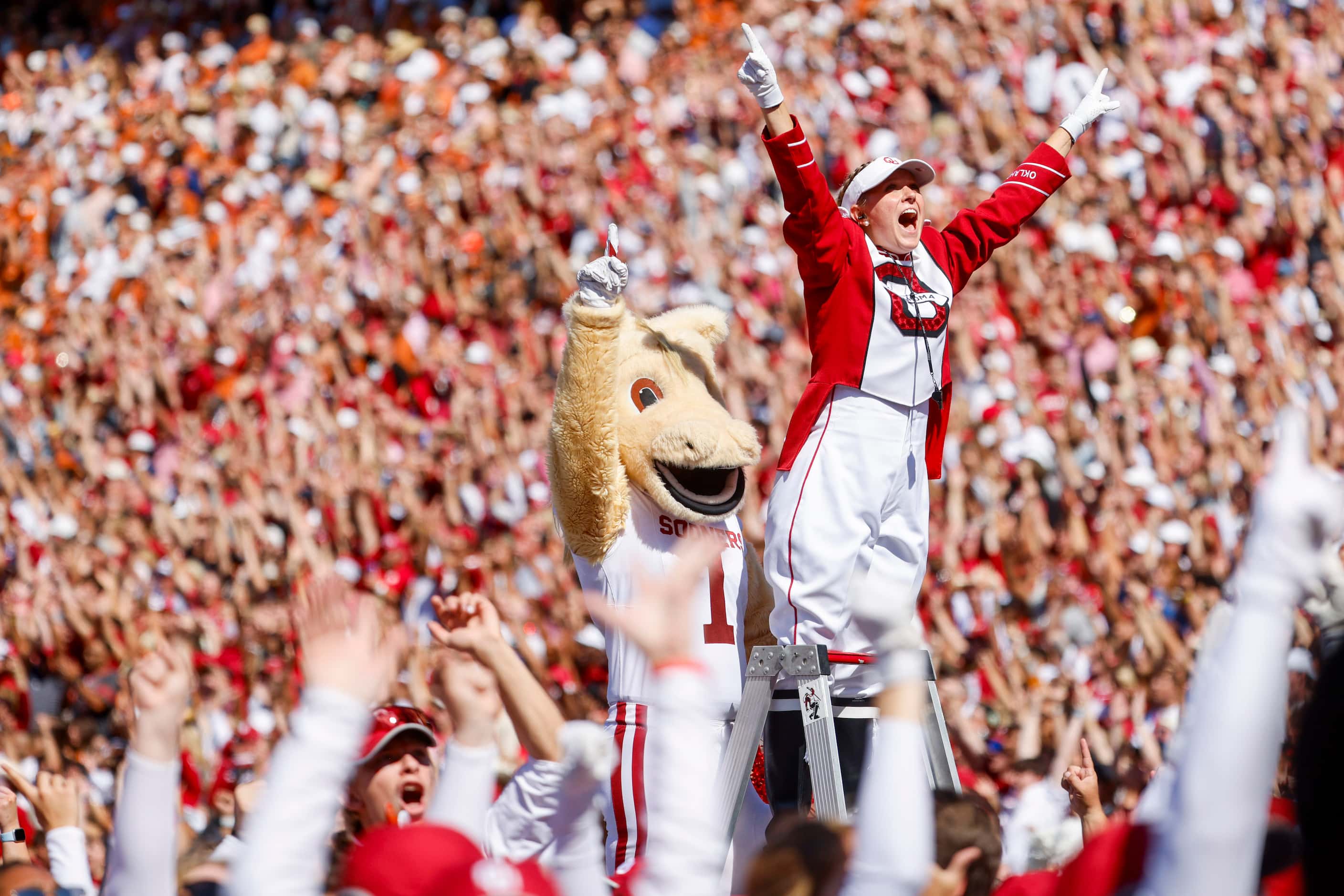 Oklahoma band members cheer after a touchdown during the first half of the Red River Rivalry...