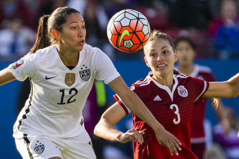 United States forward Christen Press (12) and Mexico defender Janelly Farias (3) go for the...