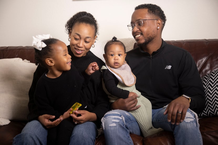 (From left) Daizha Rioland and Kenneth Rioland hold daughters, Alani, 2, and 9-month-old...