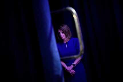 House Minority Leader Nancy Pelosi (D-Calif.) waits to speak during a midterm election night...