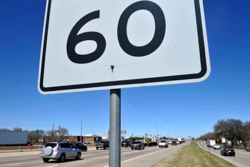
Speed limit signs read 60 mph on North Central Expressway as cars rush past. Proposed speed...