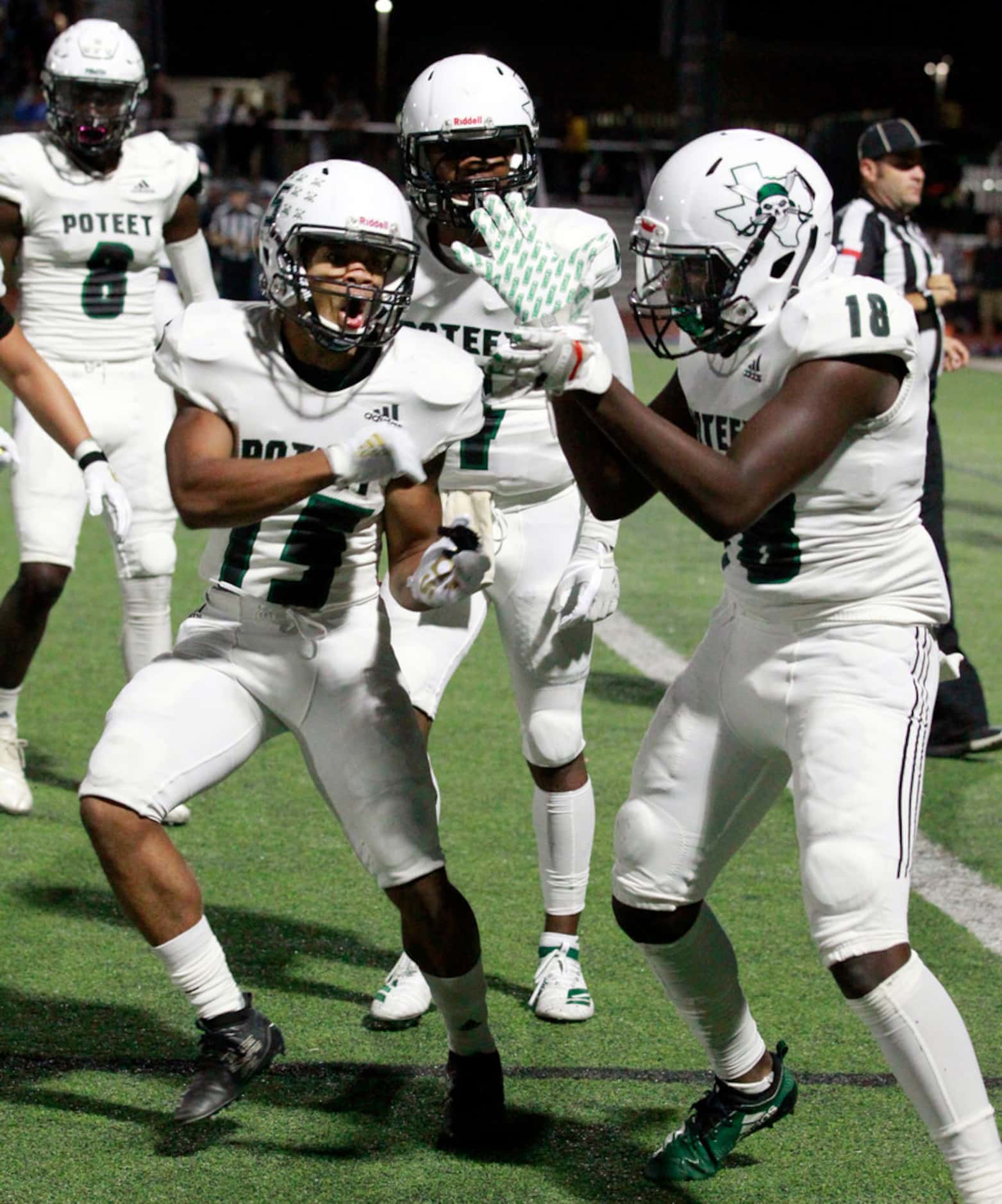 Poteet High's Xzaveon Jeans (15) celibrates with teammate De'Vyon Camps (18) after Camp's...