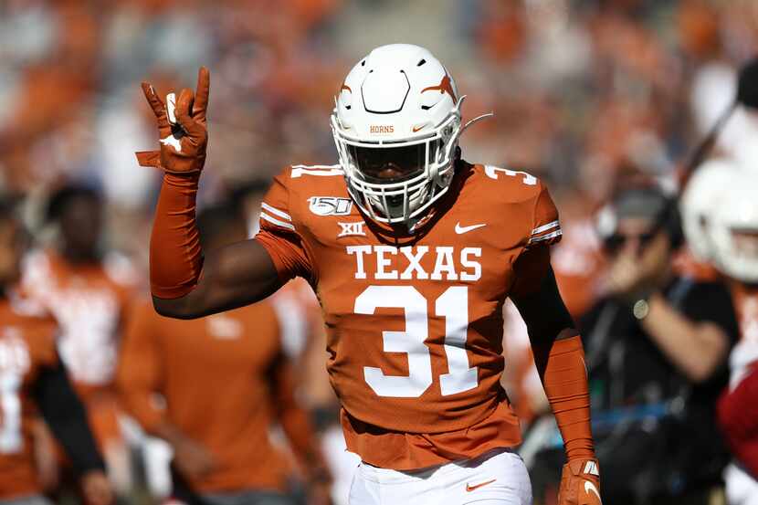 DeMarvion Overshown #31 of the Texas Longhorns runs off the field before the 2019 AT&T Red...