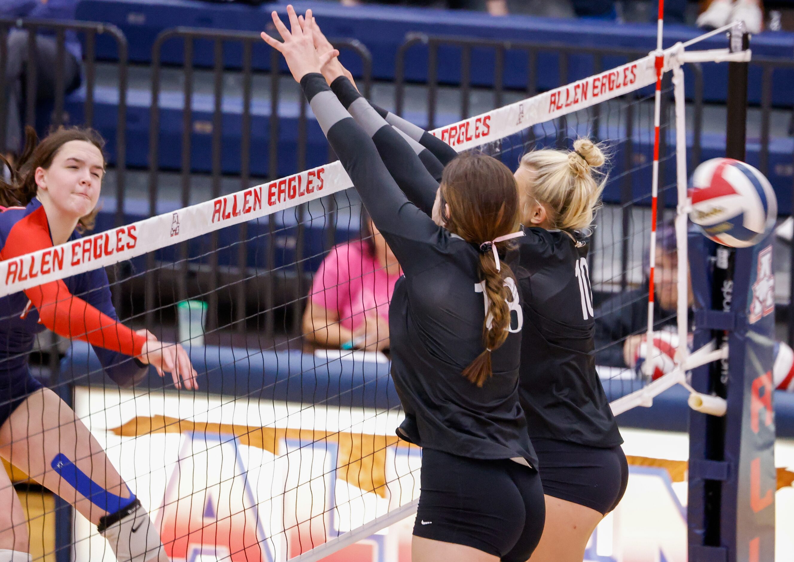 A spike from Allen junior Alyssandra Boyte (14) passes by Denton Guyer senior Erika...