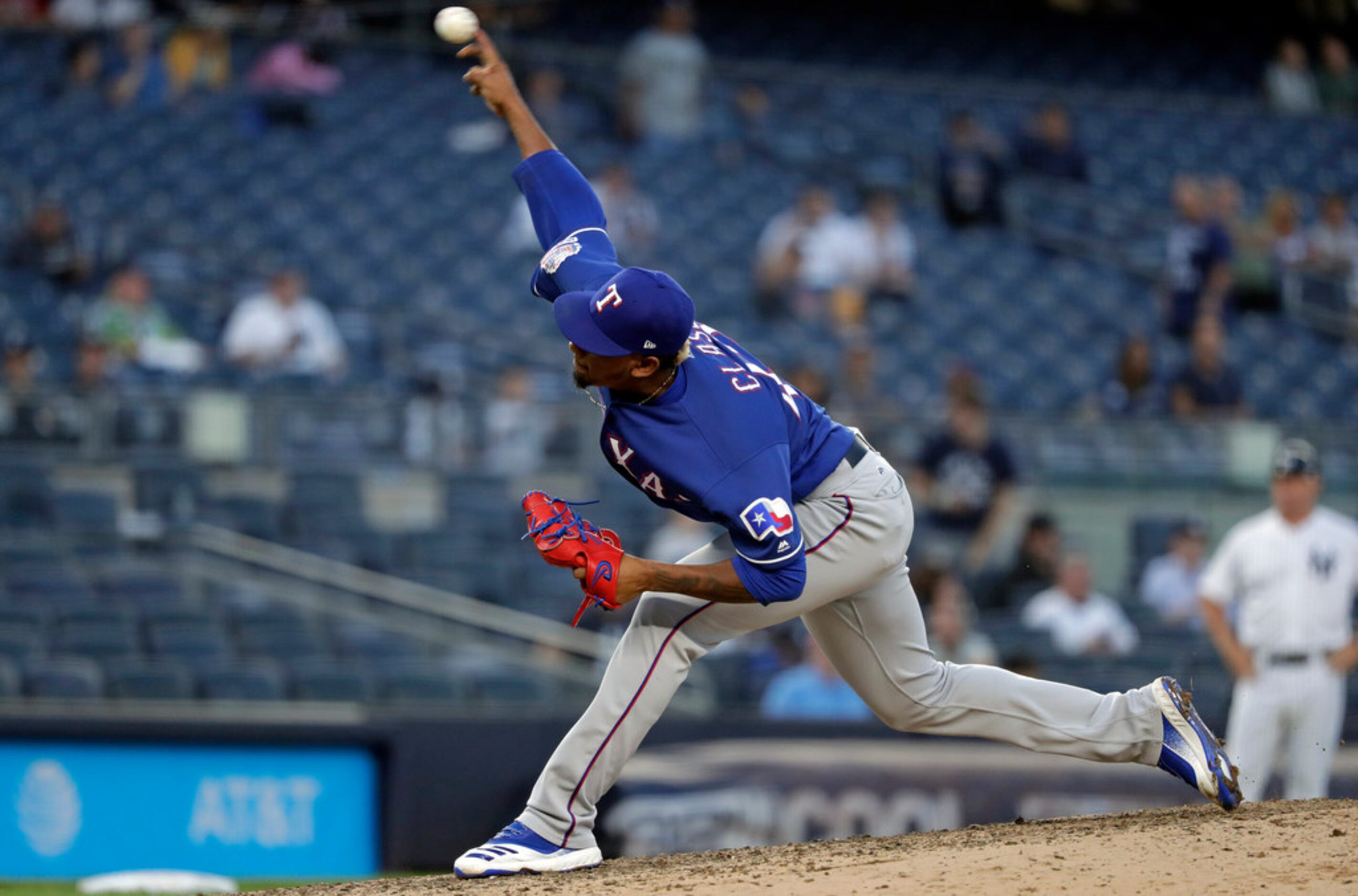 Texas Rangers pitcher Emmanuel Clase delivers during the ninth inning of a baseball game...