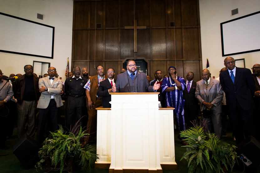 Rev. K.P. Tatum addresses the media during a news conference at Beth Eden Baptist Church on...
