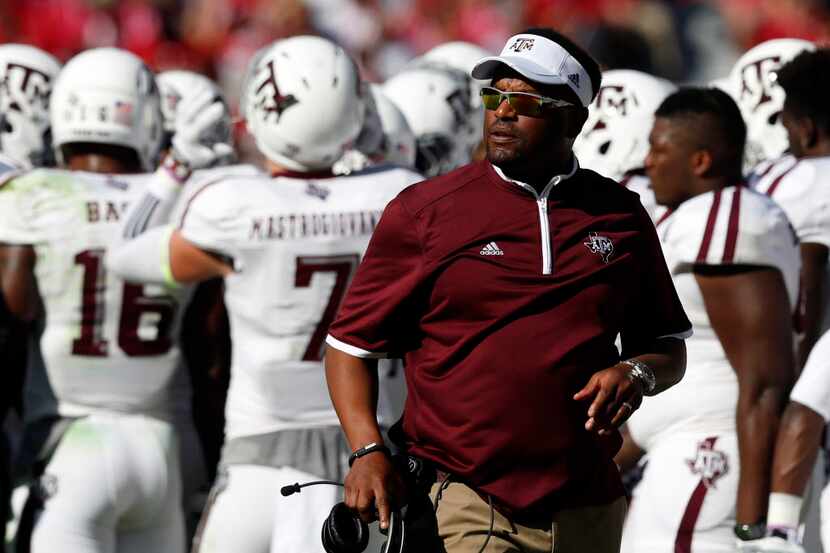 Texas A&M coach Kevin Sumlin walks the sideline during an NCAA college football game against...