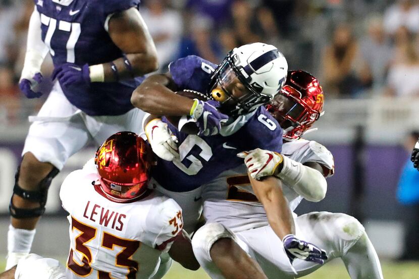 TCU running back Darius Anderson (6) is stopped by Iowa State defensive back Braxton Lewis...
