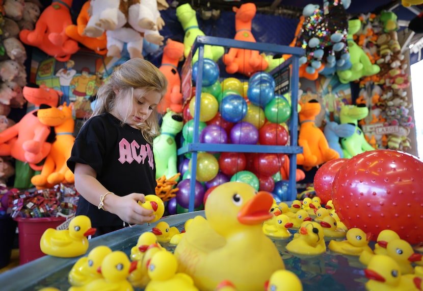 5-year-old Jolie Hughes plays the duck game at The State Fair of Texas in Dallas, TX, on Sep...