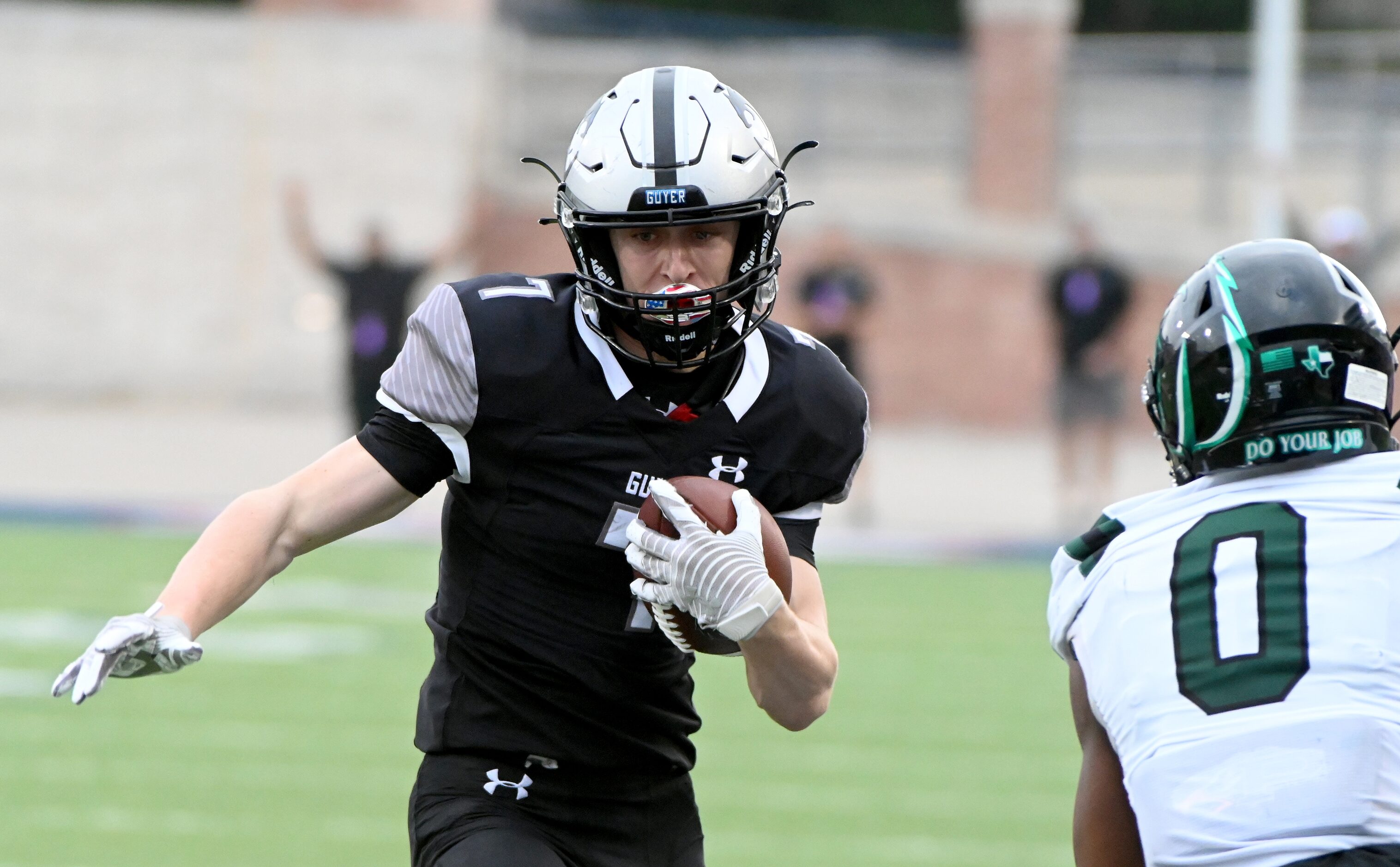 Denton Guyer's Landon Sides (7) looks for running room around Prosper's Tyler Bailey (0) in...