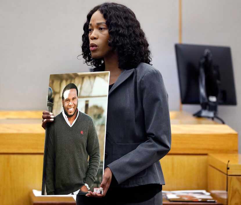 Assistant District Attorney Mischeka Nicholson shows the jury a photo of Botham Jean during...