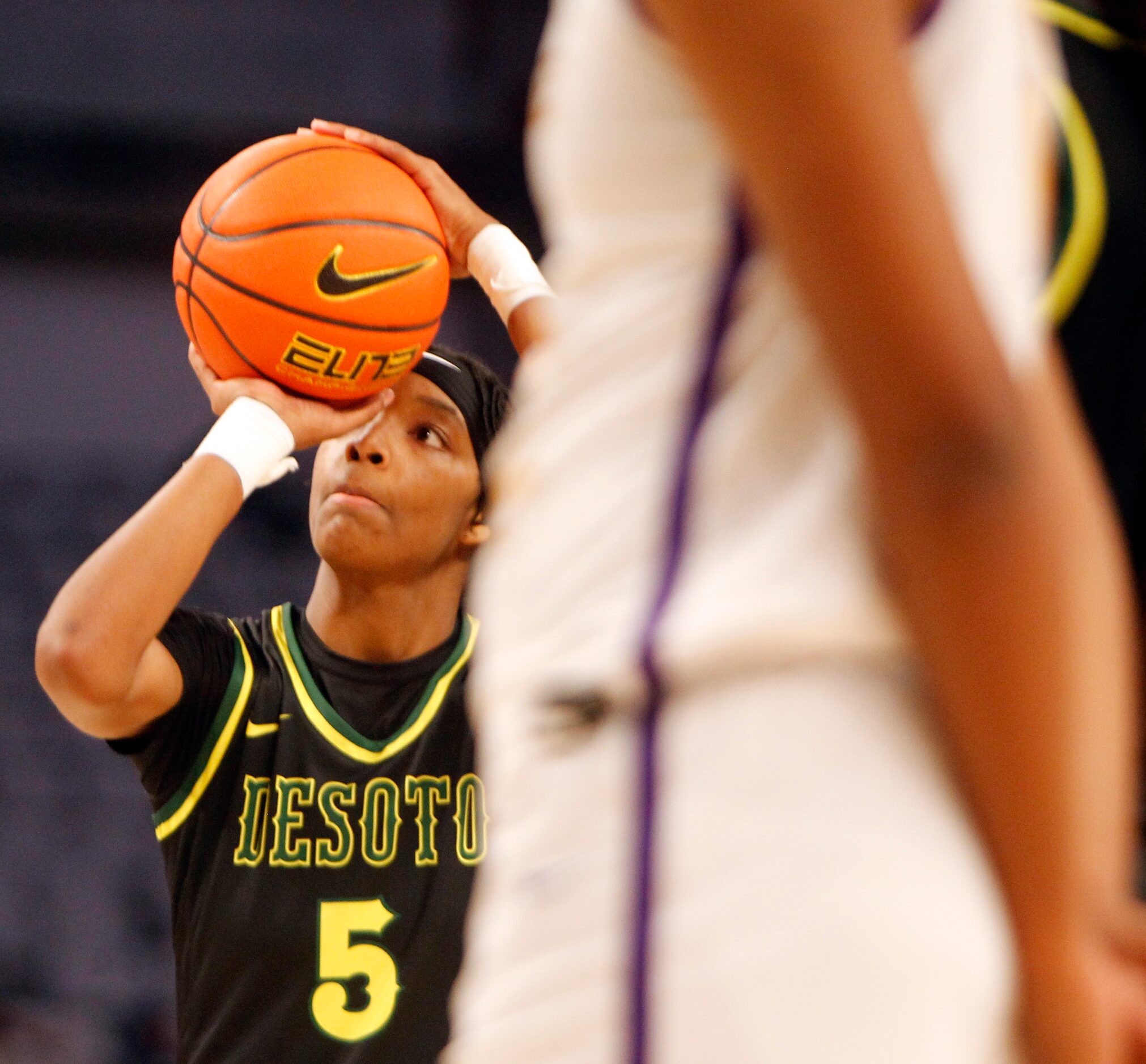 DeSoto senior Sa'Myah Smith (5) eyes a free thrown during first half action against...