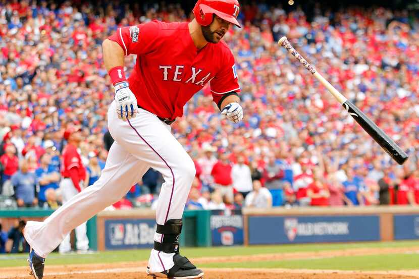 Texas Rangers batter Mitch Moreland (18) flies out to end the game against the Toronto Blue...