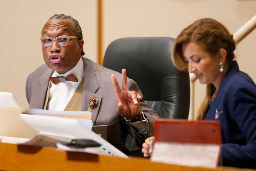 Dallas County Commissioner John Wiley Price (left) speaks next to District 4 Commissioner...