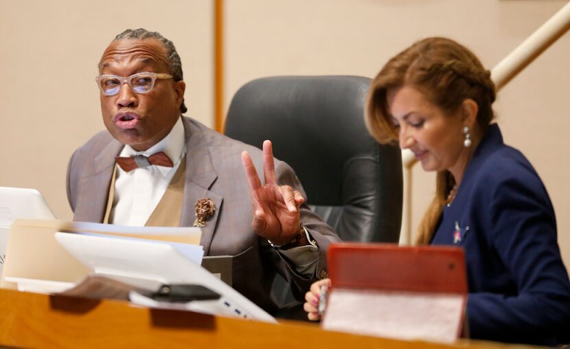 Dallas County Commissioner John Wiley Price (left) speaks next to District 4 Commissioner...