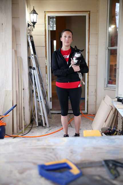 Laura Reed, with her dog Toby, and her husband didn't get flood insurance when they bought...