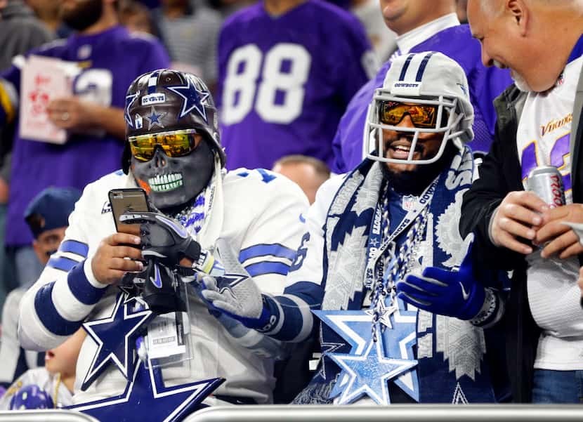Dallas Cowboys text and visit with Minnesota Vikings fans during pregame wamups at U.S. Bank...