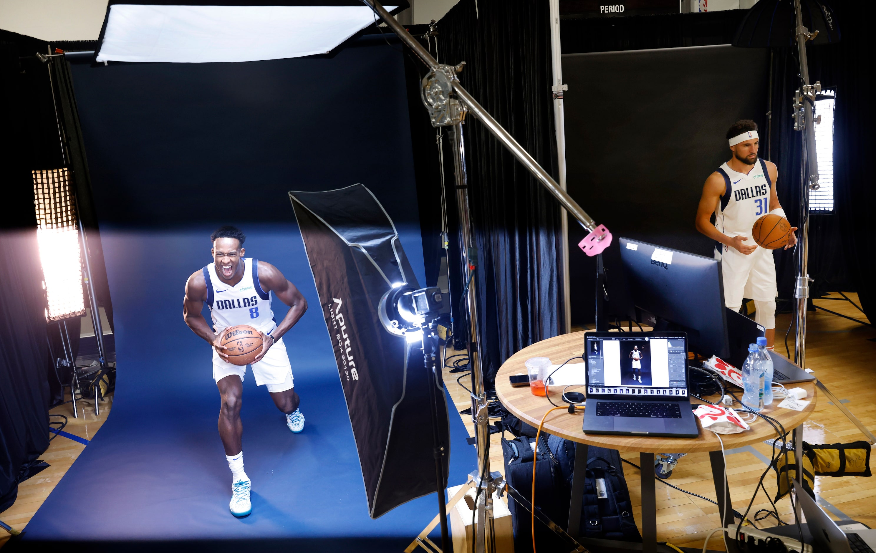 Dallas Mavericks forward Olivier-Maxence Prosper is illuminated by a flash as he poses for...