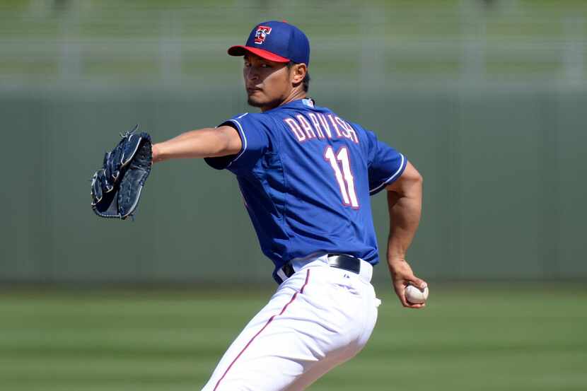 Feb 26, 2013; Surprise, AZ, USA; Texas Rangers starting pitcher Yu Darvish (11) pitches...