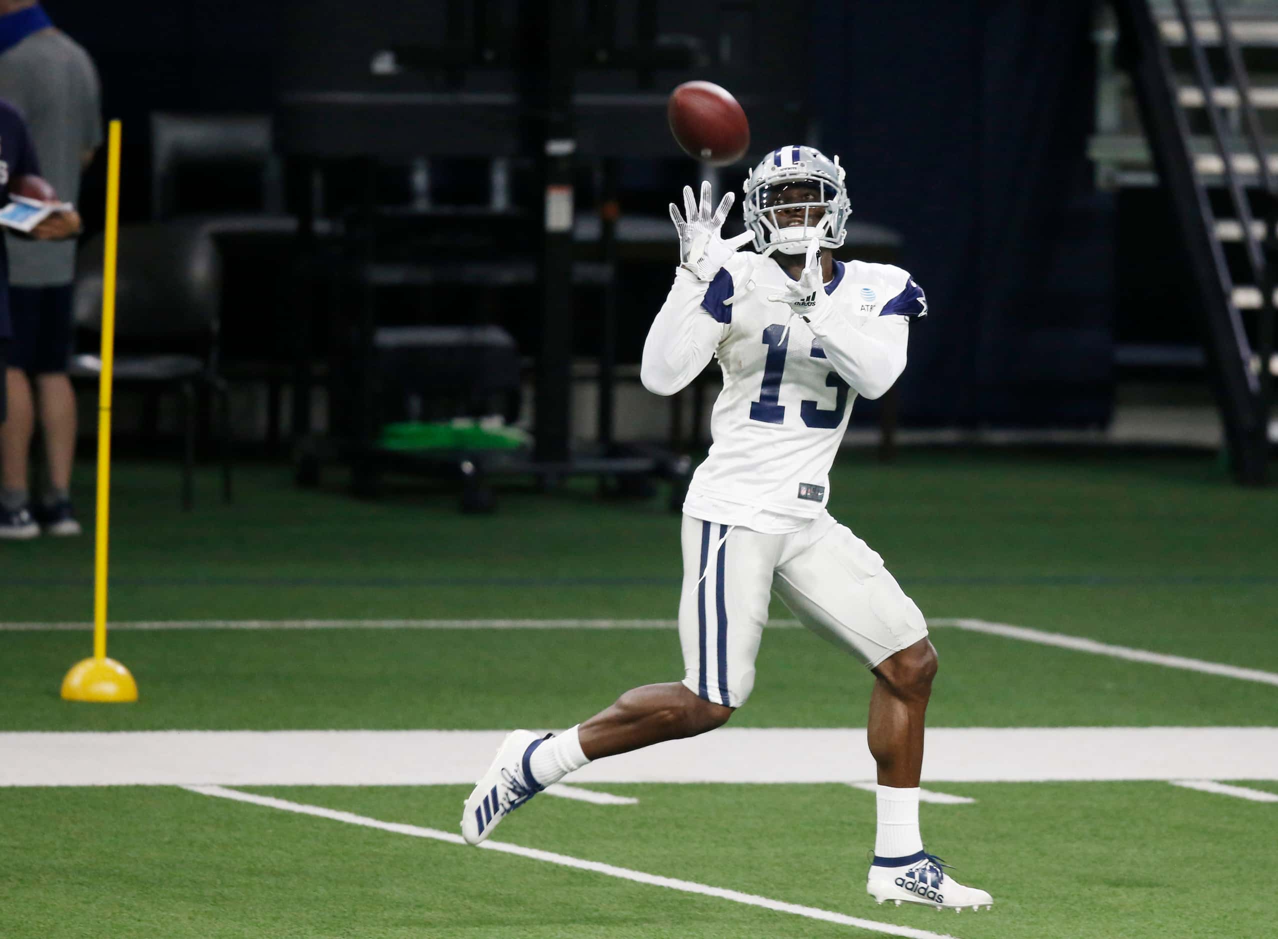 Dallas Cowboys wide receiver Michael Gallup (13) catches a deep pass during training camp at...