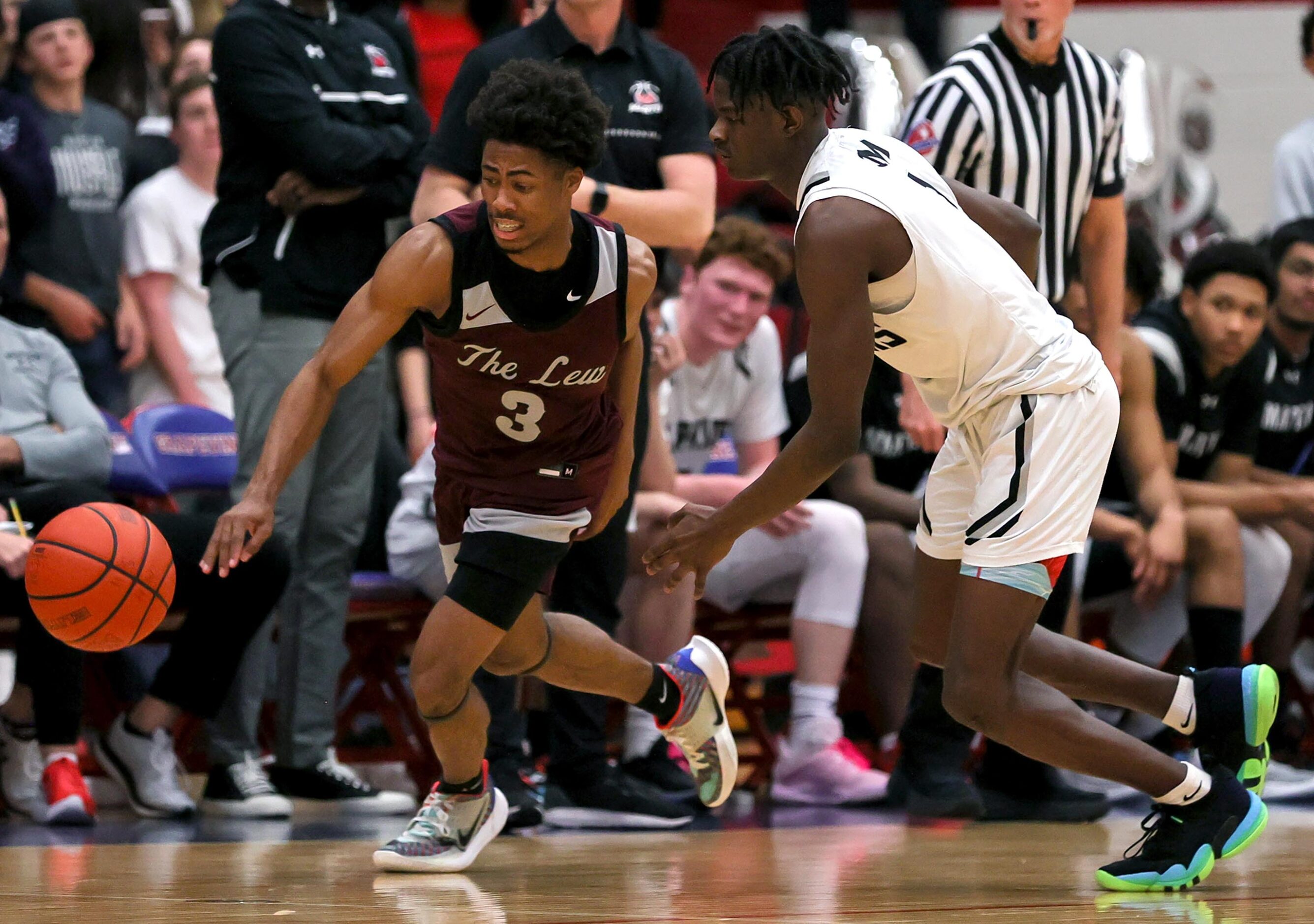 Lewisville guard Tre'lin Green (3) tries to dribble past Arlington Martin guard Jeremiah...