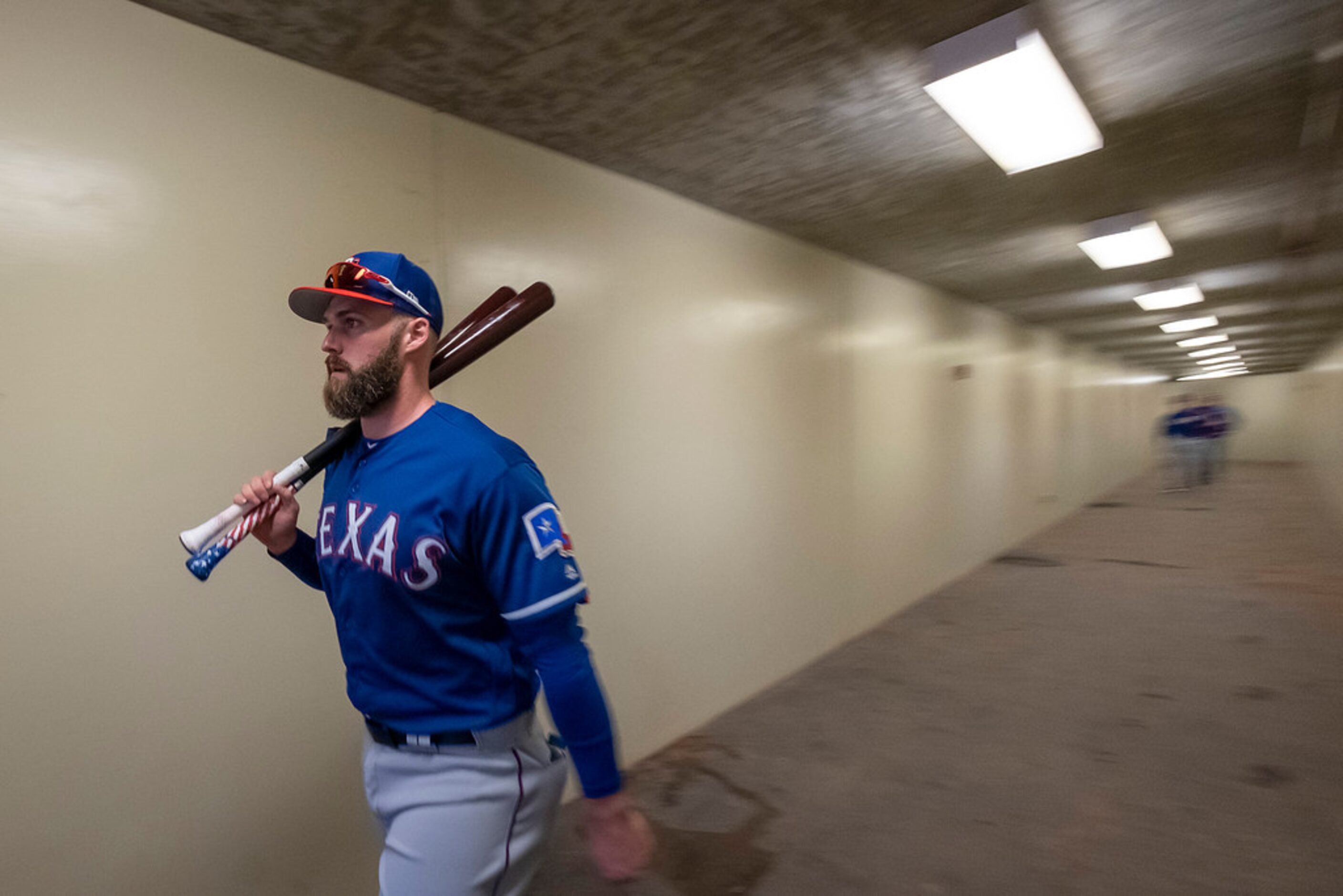 Texas Rangers infielder Matt Davidson heads out the tunnel to the field for a spring...