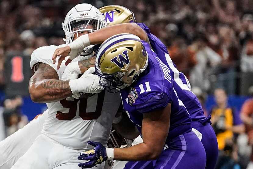 Texas defensive lineman Byron Murphy II (90) runs into the end zone for a touchdown against...