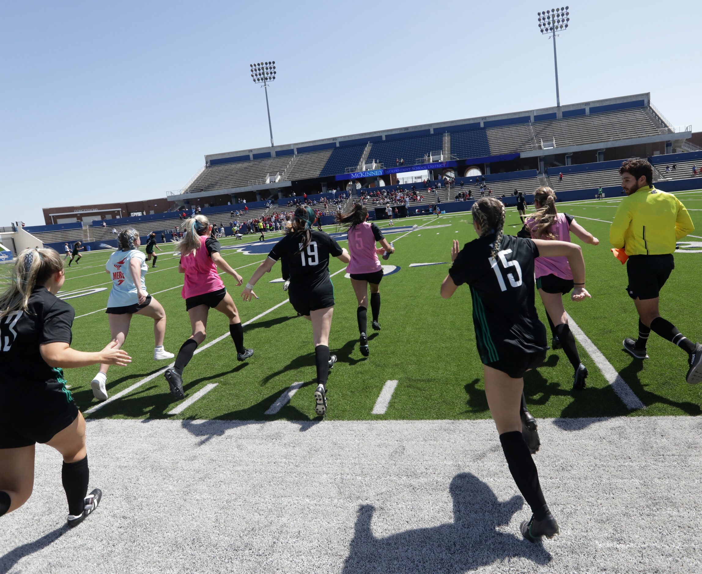 Southlake Carroll players rush the field after winning during a Class 6A Region I...