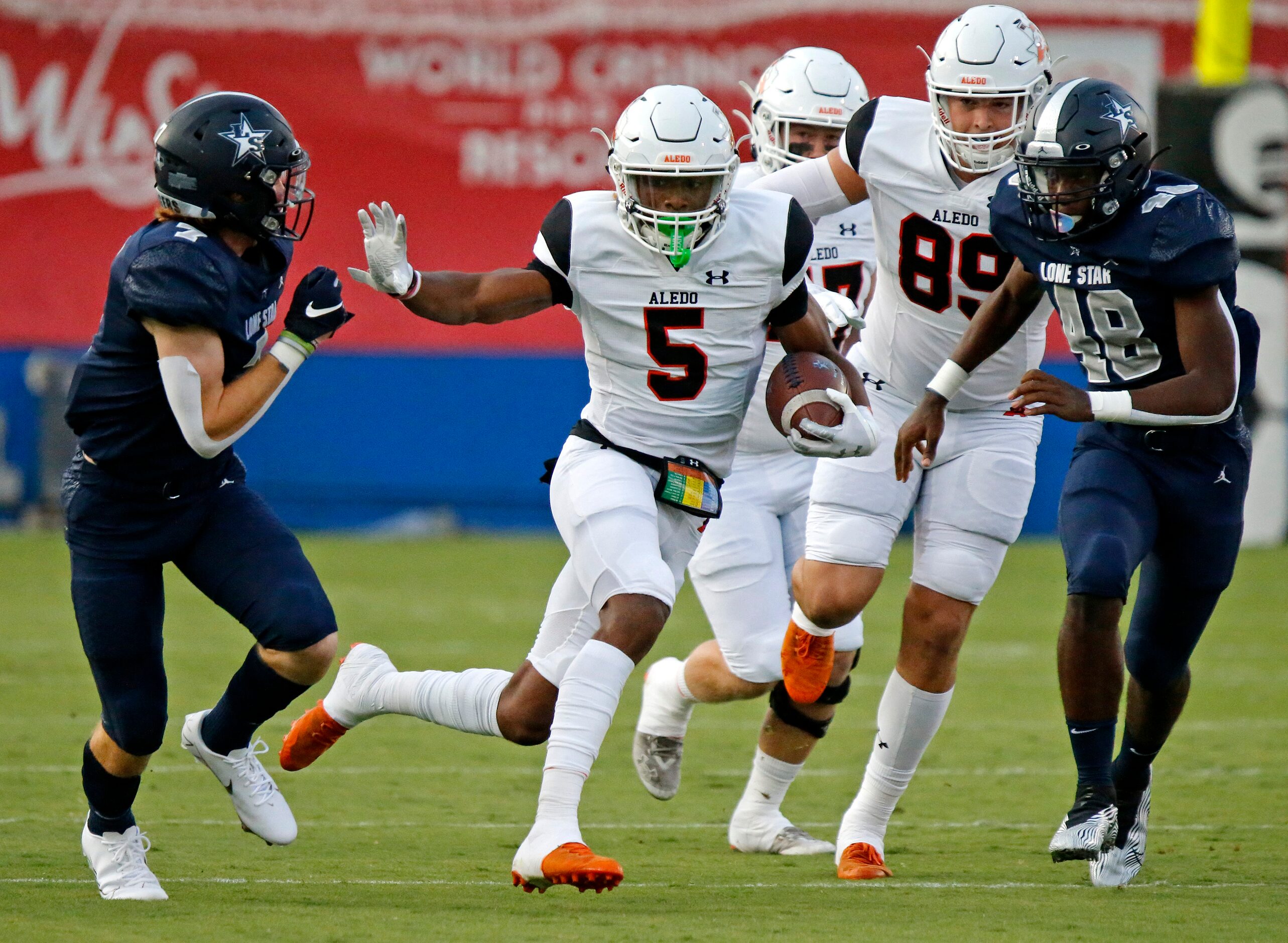 Aledo High School kick returner Ryan Williams (5) would get past Lone Star High School’s...