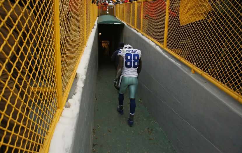 Cowboys wide receiver Dez Bryant walked disconsolately up the players' tunnel after the...